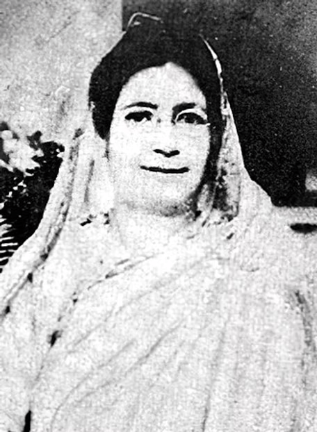a black and white portrait of Begum Rokeya, a bit grainy, so all you can see for sure is that she's got dark hair and a wrap on, but she looks nice